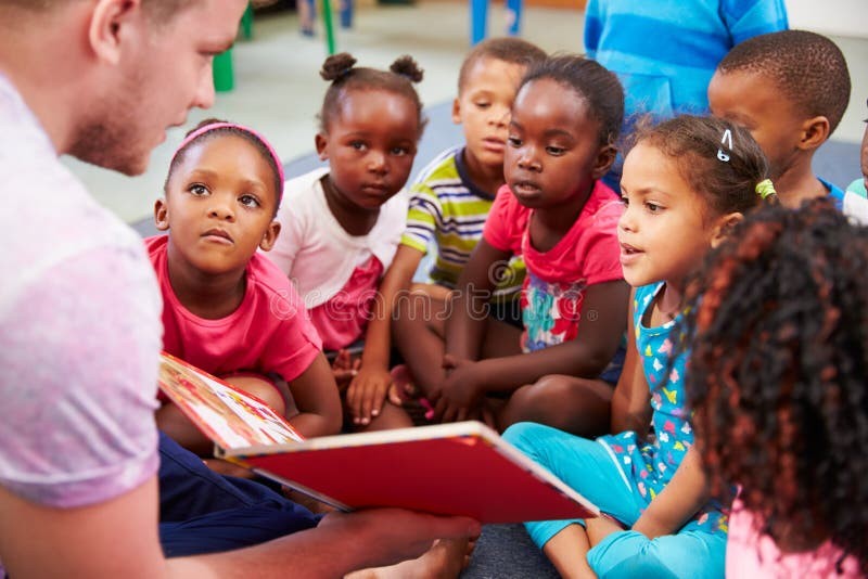Volunteer educators reading with young children
